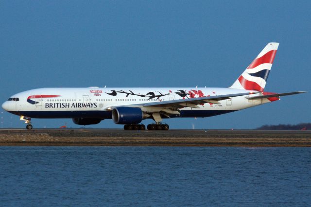 Boeing 777-200 (G-YMML) - British Airways B772 in special 'Great Festival of Creativity' livery departs BOS at dusk for LHR on 4/11/22.