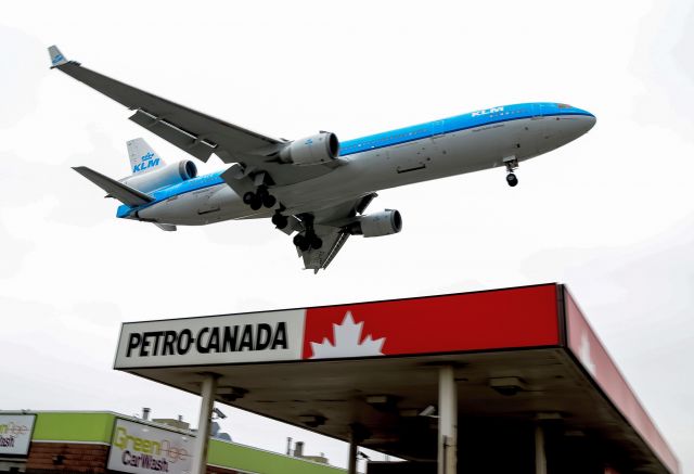 Boeing MD-11 (PH-KCE) - KLM MD11 landing Toronto flyby gas station landmark of Rwy 23.