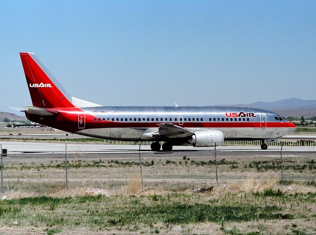 BOEING 737-300 (N513AU) - KRNO - early 1990s view of ill-fated N513AU at the hold bars at Reno.