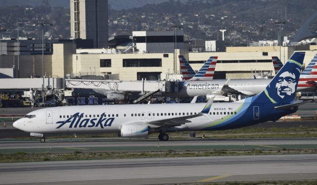 Boeing 737-900 (N317AS) - Taxiing to gate after landing on 25L at LAX