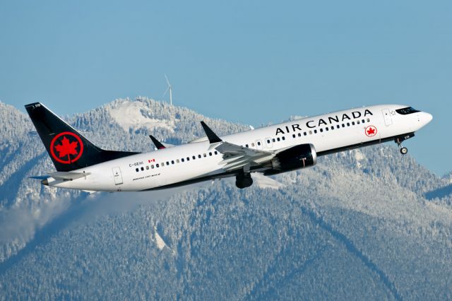 Boeing 737 MAX 8 (C-GEHI) - Passing Grouse Mountain in the background