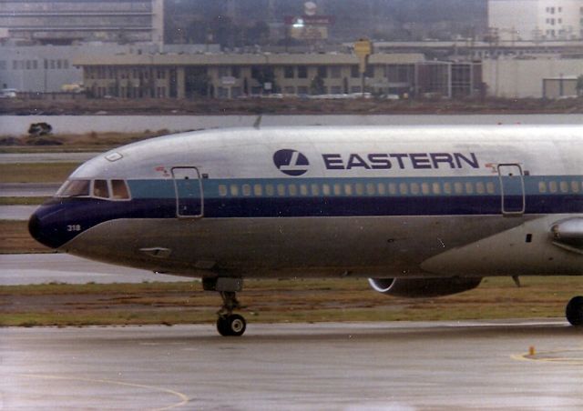 Lockheed L-1011 TriStar (N318EA) - Just arrived at KSFO on 19R- This L1011 (cn 193A-1039) taxi's to the gate - rarely photographed N318EA ended life Daegu, Korea, as a Restaurant. This photo from the old observation deck at KSFO 1970's- 1000mm lens shot.