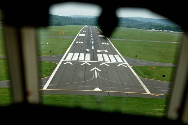 Dassault Falcon 2000 (N197JK) - Right before touching down on runway 18 at KOXC.