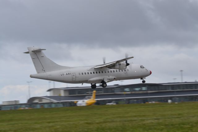 Aerospatiale ATR-42-300 (LY-ARI) - Operating Rotterdam to Guernsey service for Cityjet. Landing just as a heavy rain shower started