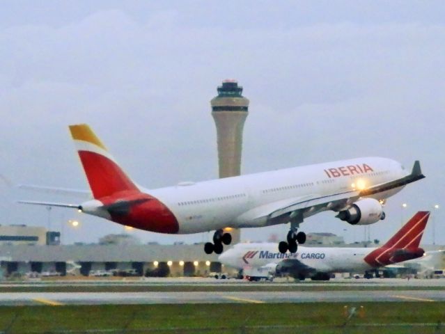 Airbus A330-300 (EC-LZJ) - A Martinair B747-400F Reg#PH-MPS"Being pushed back"In the distance!