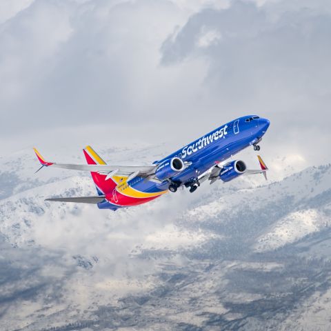 Boeing 737-800 (N8643A) - Southwest 737-800 departing with Utah's mountains in the background. I took this from a nearby warehouse parallel to the runway.