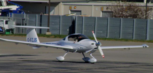 Diamond DA-20 (C-FZJS) - A Diamond Katana (C-FZJS) taxis to TAC Air (FBO at Blue Grass Airport-KLEX), a stop en route to London International (Ontario) (CYXU)...  C-FZJS and C-GLGS were flying together....