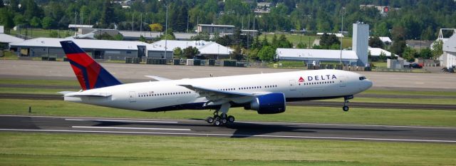 Boeing 777-200 (N708DN) - Brand new Delta Airlines Boeing 777 taking off from Portland International Airport.