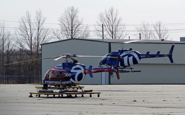 Bell JetRanger (N11TV) - LINDEN AIRPORT-LINDEN, NEW JERSEY, USA-MARCH 13, 2024: News helicopters from two of the local New York City television stations are seen by RF at approximately 1510 hrs. Preparing to land is N11TV while in the foreground is N77NY.