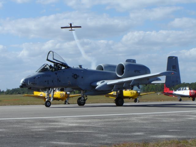 — — - Super Decathlon passing airshow line above A10 taxing out.