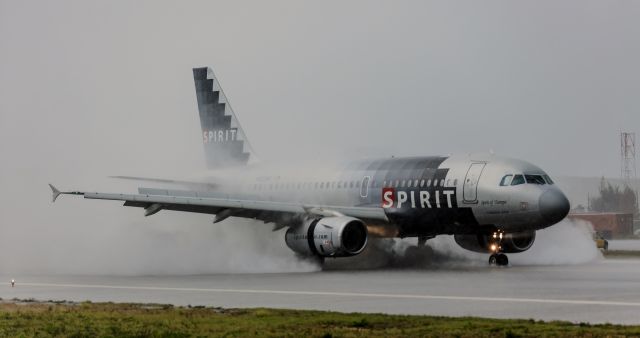 Airbus A319 (N523NK) - Wet Fete Spirit wings 100 or NKS100 Airbus A319 Spirit of Tampa making use of what ever breaking action there was during that heavy down poor of rain while the majority of the others diverted to other airfields all about the Caribbean. br /N523NK.br /06/10/2018