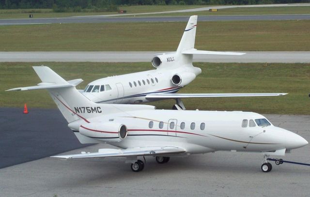 Hawker Siddeley HS-125-400 (N175MC) - Super example of a Hawker 700 N175MC being towed to its parking spot at Fulton County Atlanta (KFTY) during the NBAA 2007 ..Photo by Mike Day