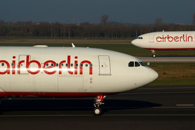 Airbus A330-200 (D-ALPJ) - With D-AERQ in background.