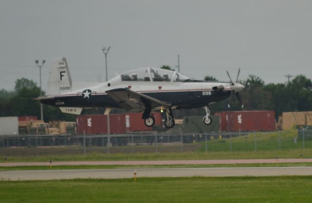 Raytheon Texan 2 (16-5998) - US Navy T-6A 165998 of the TAW-6 on final to Runway 15 in Siouox Falls SD on 6-12-15