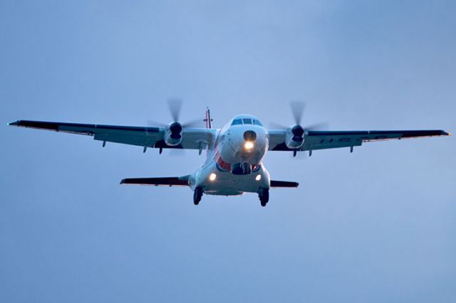 CG2302 — - 4/10/13:  U. S. Coast Guard HC-144A Ocean Sentry #CG-2302 on short final approach over Miami Lakes at sunset enroute to runway 9-left at Opa-locka Executive Airport, home to Coast Guard Air Station Miami.