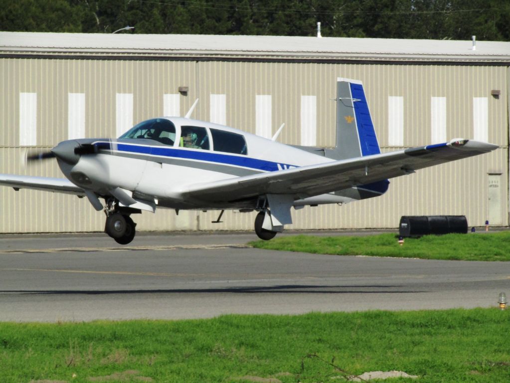 Mooney M-20 Turbo (N231FE) - Taking off from RWY 24