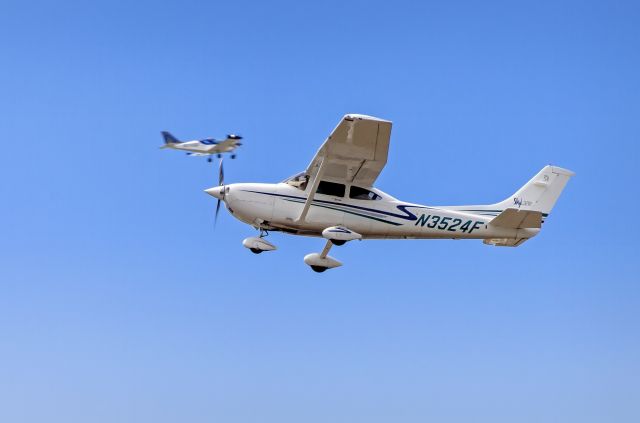 Cessna Skylane (N3524F) - Aircraft flying touch and goes. You could say I got two birds with this shot! :)