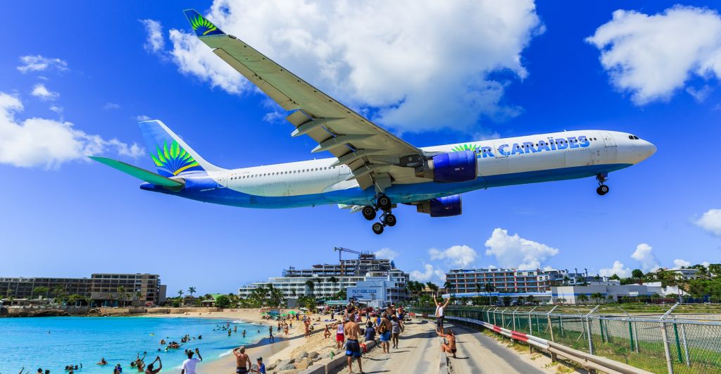 Airbus A330-300 (F-GOTO) - Air Caraibes zooming over maho beach for landing at St Maarten. with their Airbus A333 F-GOTO.✈️✈️♥️