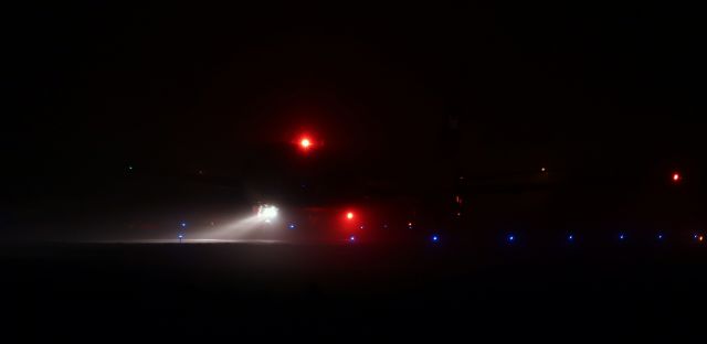 BOEING 767-300 (N158FE) - The fog was so incredibly thick I could barely see this Fed Ex Heavy as it turned off the only open runway as it arrived from Memphis ... and I wasn't standing very far away. Except for the nose gear headlights and the red beacons, the only other visible marking was the "Fed" on the tail, and despite the fact that the tail was brightly lit up, the letters are almost undetectable. I have never seen it this foggy at RNO.