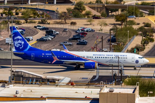 Boeing 737-900 (N265AK) - An Alaska Airlines 737-900 in Honoring Those Who Serve special livery taxiing at PHX on 3/4/23. Taken with a Canon R7 and Canon EF 100-400 L II lens.