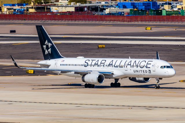 Boeing 757-200 (N14120) - A United Airlines 757-200 in Star Alliance special livery taxiing at PHX on 2/24/23. Taken with a Canon R7 and Canon EF 100-400 ii lens.