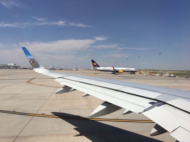 Airbus A321 — - Taxiing to runway 8, we passed the Icelandair 757-200 parked on the tarmac. Icelandair flies this plane to Keflavik International from Denver.br /Taken mid afternoon on June 28, 2016.