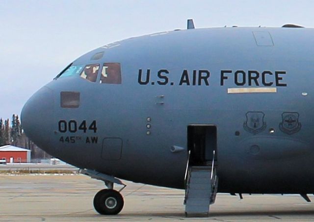 Boeing Globemaster III — - Flight crew busy in the cockpit.