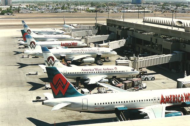 Airbus A320 (N640AW) - KPHX -- April 1999 view from the parking structure, - Sky Harbor. Note the 2 737-200s in this view.