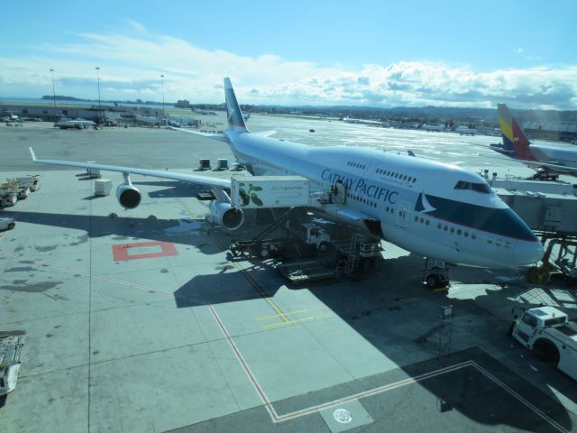 Boeing 747-400 (B-HUG) - CX879 getting loaded up with provisions for the 14.5 hour non-stop from SFO to Hong Kong.