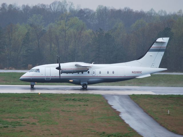 Fairchild Dornier 328 (N328DC) - BRAUN RACING rolling down runway 20 - 4/1/09