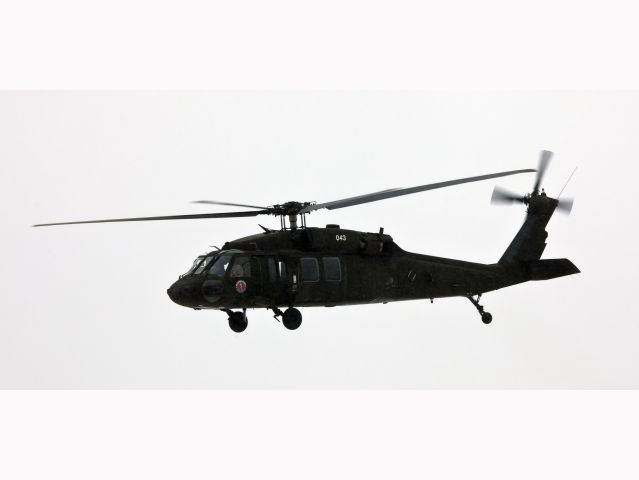 N043 — - Flying in heavy rain. No type or location information will be provided for US military helicopter.