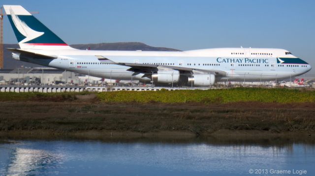 Boeing 747-400 (B-HUG) - From the Bayshore Trail in Millbrae, CA, spotting a Cathay Pacific B-747-462, Flight CX879, depart for HKG.