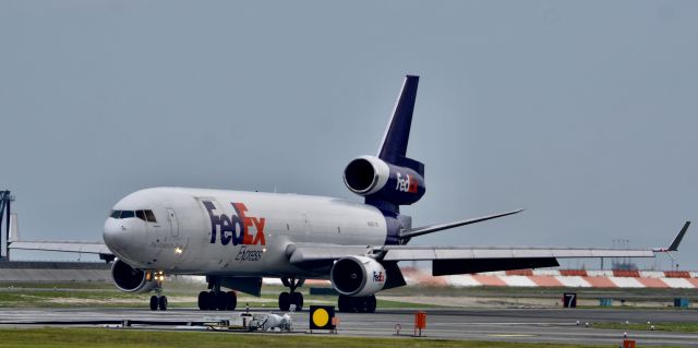 Boeing MD-11 (N583FE) - All I have to say is WOW! This is the first time that 1. Fed Ex has ever come to RJOI and 2. that an MD-11 has (or at last the year and a half that I have seen) come here! The sound was incredible! If you would like the video just email me at sc00by07@icloud.com and I'll send it. Here it is taxing off the runway to go to the cargo ramp. Vote if you like the photo! 