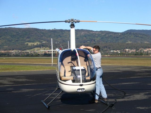 Robinson R-22 (VH-HOZ) - Refueling at YWOL on way back to YSBK from Kangaroo Valley.