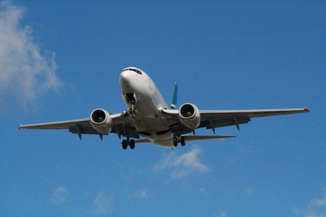 BOEING 737-600 (C-GXWJ) - Arriving on a blustery afternoon at YUL