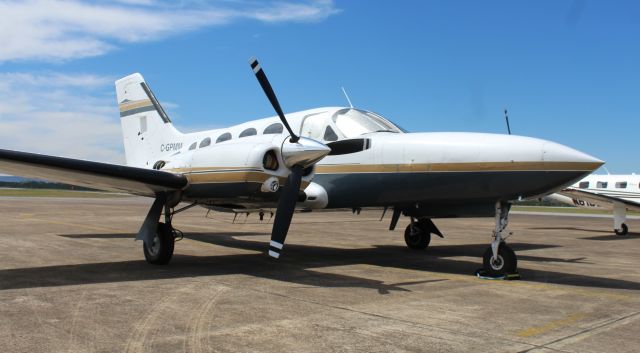 Cessna 421 (C-GPMM) - A Canadian-registered 1977 model Cessna 421C Golden Eagle on the ramp at Northeast Alabama Regional Airport, Gadsden, AL - March 29, 2023.