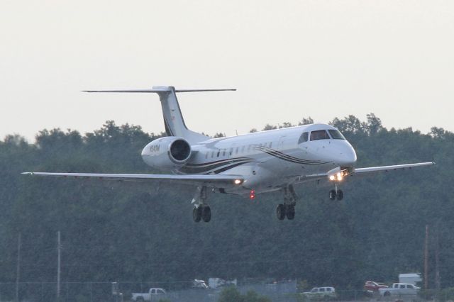 Embraer ERJ-135 (N540M) - While the rain made it difficult for a good shot, N540M (Menards E135) was seen here in her new colors. This shot was taken as N540M was about to touchdown on RWY 25 at KTOL on 20 Jul 2018.