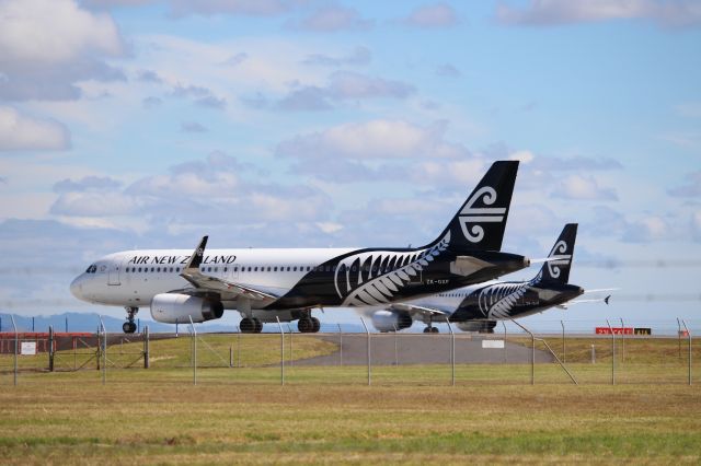 Airbus A320 (ZK-OXF) - ZK-OXF and ZK-OJF awaiting departure from Auckland Int.