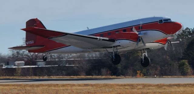 N115U — - Modified DC-3 performing a touch-n-go