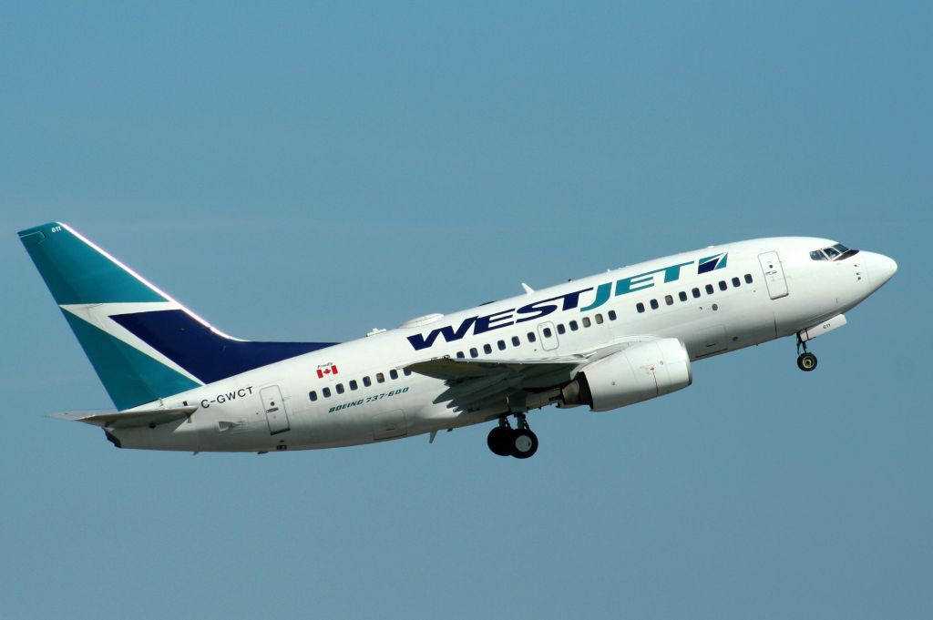 CGWCT611 — - Early morning takeoff from runway 7. This Boeing 737-6CT has been in service since 2006.   This picture taken on 01-July-11.