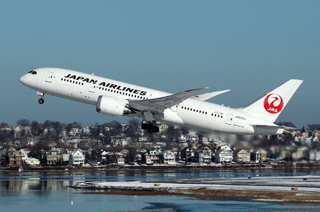 Boeing 787-8 (JA830J) - Tokyo bound JAL 7 departing against the snowy backdrop of East Boston, Massachusetts.