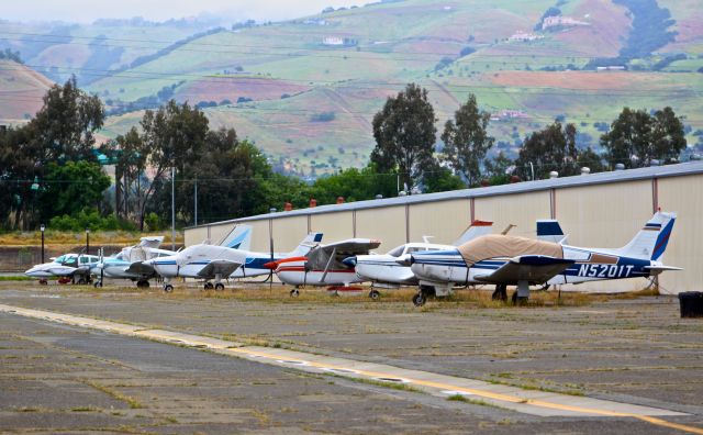 — — - Long row of pistons at Reid Hillview. Unfortunately, most of these aircraft dont fly anymore and have been sitting for years.