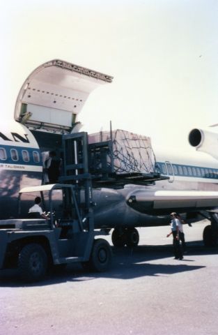 Boeing 727-100 — - 1967  Ilopango Airport El Salvador  Loading 727 Cargo  (QC). Quick Change)  This acft can convert to passenger acft   Note   Using Forklift until we got our scissors lift