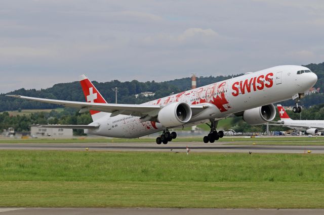 BOEING 777-300 (HB-JNA) - "People's Plane" livery