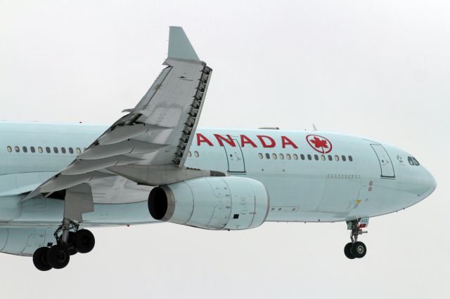 Airbus A330-300 — - Landing at LHR.