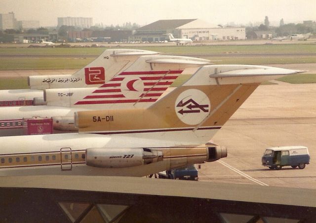 BOEING 727-200 (5A-DII) - Three 727 tails in a row - a regular sight in the 1980s at Heathrow.