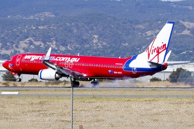 Boeing 737-800 (VH-VUT) - Putting down on runway 05. Friday, 19th April 2013.