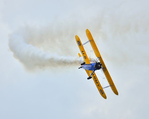 — — - John Mohr banking hard left in his Stearman at Sun n Fun 2013, Lakeland Linder Airport, Florida