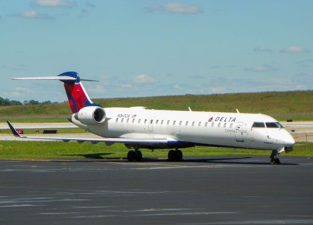 Canadair Regional Jet CRJ-700 (N367CA) - Endeavor air CRJ-700 that used to belong to COMAIR sitting the Endeavor hangar.