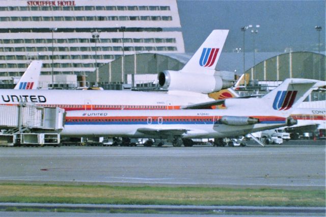 BOEING 727-200 (N7284U) - Stapleton - 1000mm lens view from the viewing platform area ( it was locked ) I also shot a lot of video here.The UAL 10 heavy's would touch down in the perfect spot and I filmed some great arrivals.